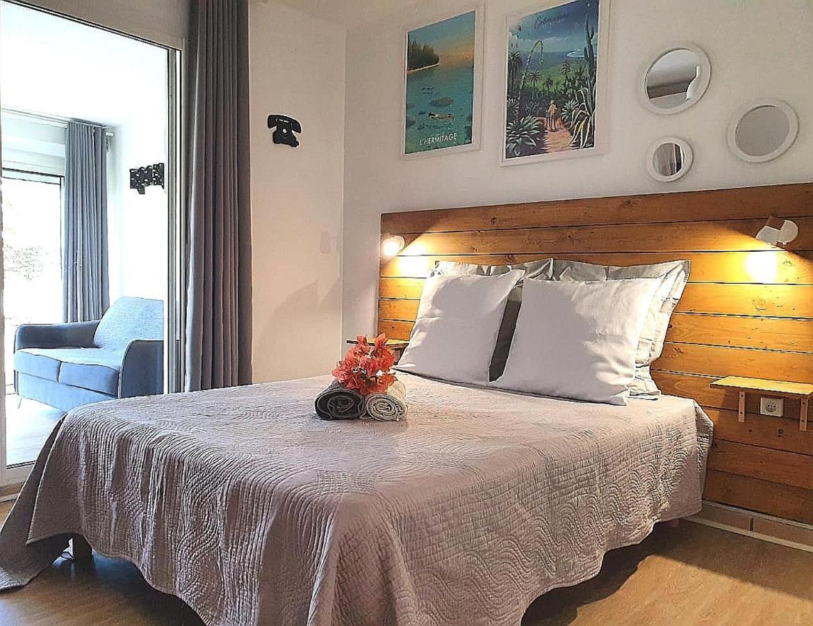 Au Bord De L'Eau La Saline Les Bains Apartment Bagian luar foto